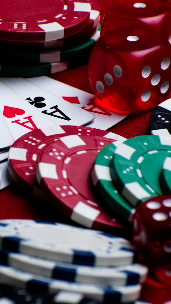 About Colorful assortments of poker chips, dice, and playing cards create a vivid casino scene.